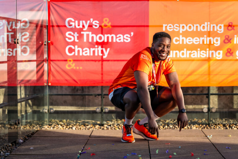 A supporter of GST smiles after running the London Marathon