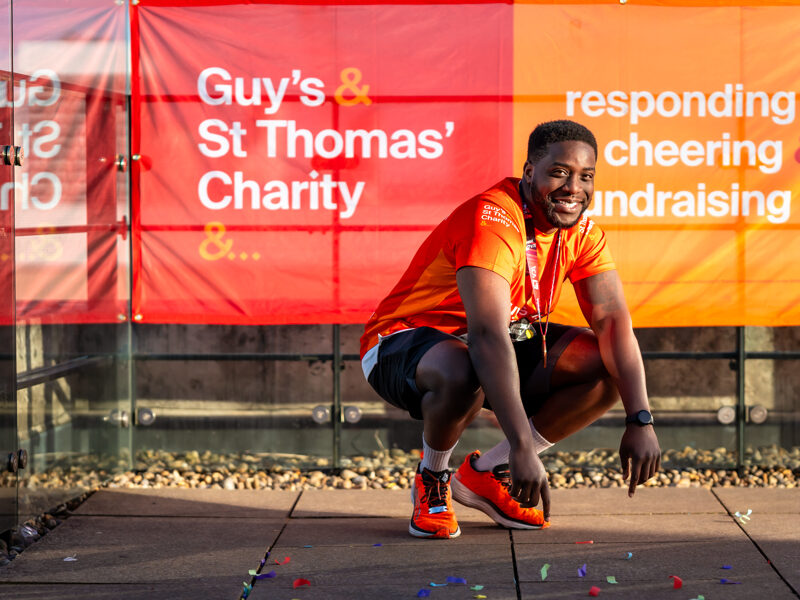 A supporter of GST smiles after running the London Marathon