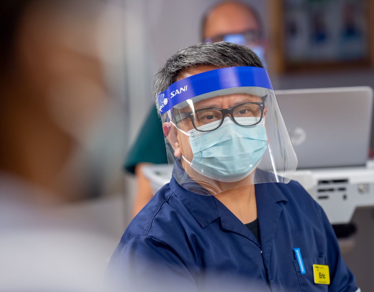 Male hospital worker in full PPE