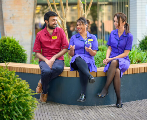 Image of staff sat in the Florence Nightingale Garden