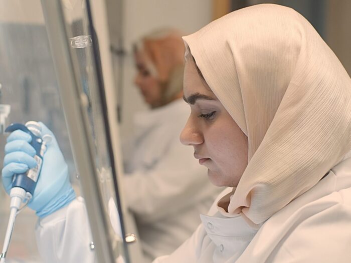 Woman in a hibjab conducting medical research.