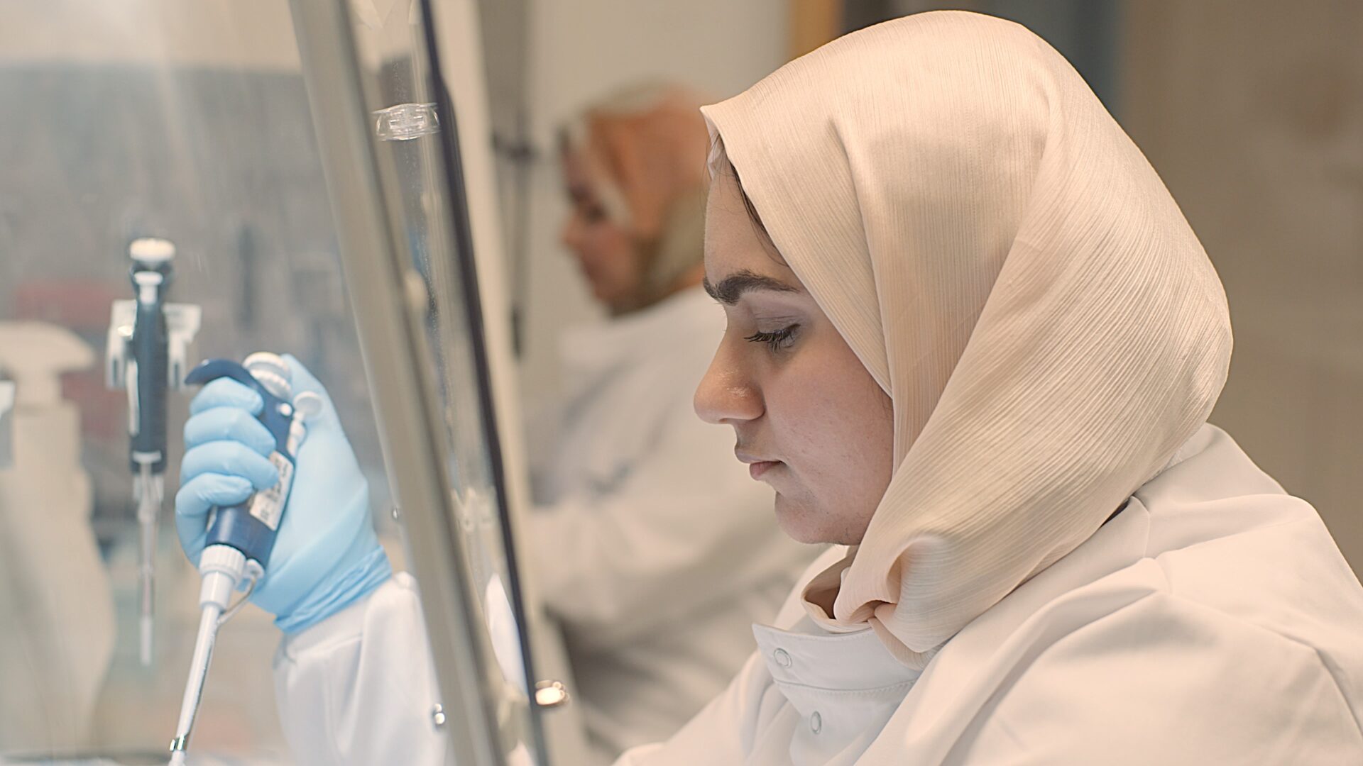 Woman in a hibjab conducting medical research.