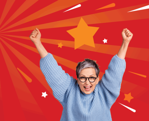 Woman in light blue jumper wearing black rounder glasses with her arms up in the air appearing to cheer, on the left a graphic in white text that reads 