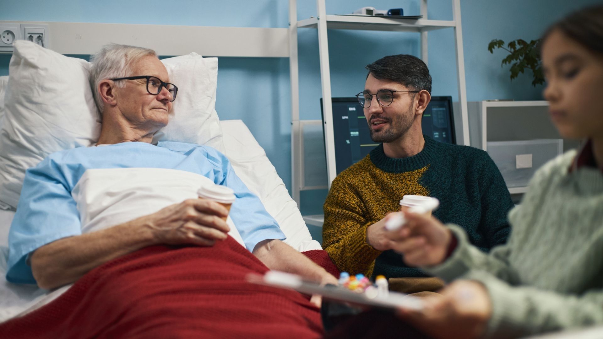 Elderly man with his son in hospital